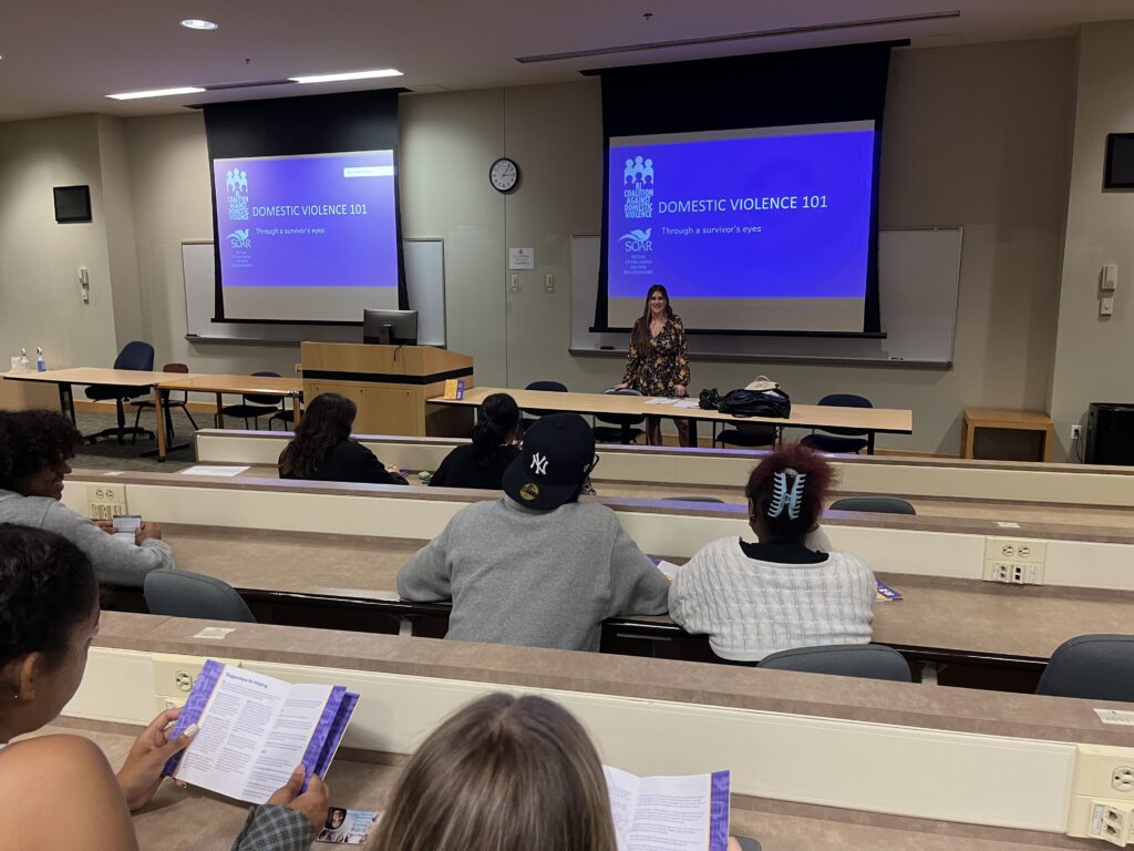 Woman at the front of a classroom.